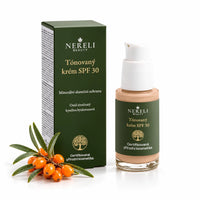 Tónovaný minerální opalovací krém SPF 30 NERELI, 30 ml – kompozice s rakytníkem na bílém pozadí